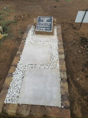 The new gravestone that Ramile made from goods other residents threw away at the Fochville waste transfer station.