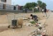 Despite the fact that there was a big storm approaching, this desperate Kokosi resident was busy taking water from a manhole on the sidewalk across from Extension 99 on November 6. Many residents have been forced to use water from unsafe places such as manholes due to the severity of the water problems in this area. Photo: Adele Louw