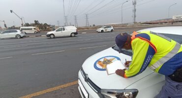 One of the traffic officers writing out a fine. Photo: Supplied.
