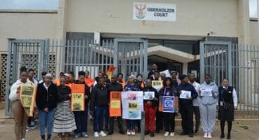 Friends, family, and other concerned residents picketed outside the court.