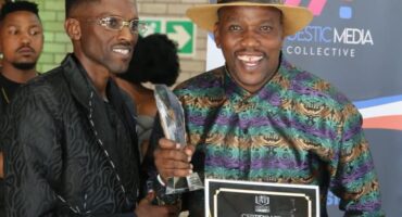 The organiser Glad Zitha handing over a certificate to the artist Godfrey Mahlangu. Photo: Supplied