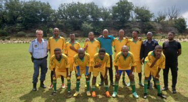 The Wedela Station Commander, Captain Wayne Pestana, with the SAPS soccer team.