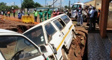 The sinkhole had caved in up to right under two taxis parked in the Motladile family's front yard.
