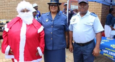 The West Rand District Commissioner, Major General Lorraine Challen, Acting Khutsong Vispol Commander Captain Goitsemodimo Eddie Boboko and Mother Christmas during the event.