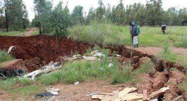 There are large cracks on several sides of the sinkhole, which shows that it is going to cave in further.