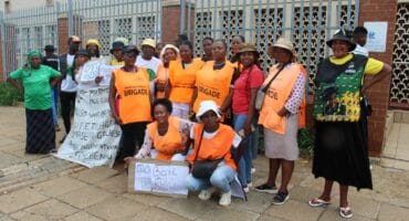 Community members and victim advocates gathered outside the Oberholzer Magistrate's Court.