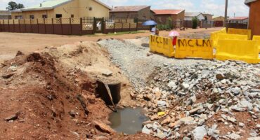 Sewage is still leaking from the open pipe that allegedly caused the sinkhole.