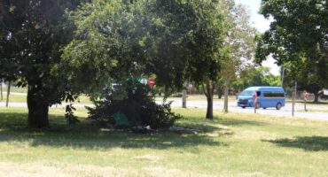 These bags are the remains of where the deceased stayed on the traffic island just across from the 007 shopping centre.