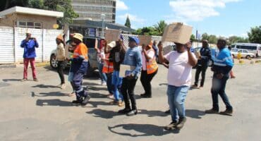 The group marching to the hospital's gates.