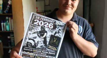 Carletonville SPCA staff member Adriaan van Niekerk with the poster advertising the event.