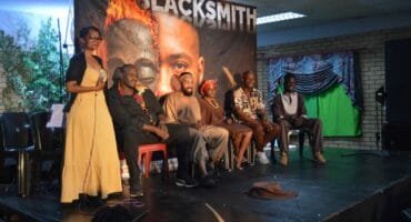 The Blacksmith cast on stage.