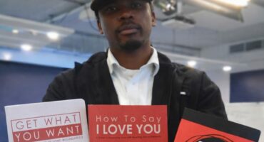 The author Motseki ''Quan'' Rabotapi with his three self published books. Photo: Supplied