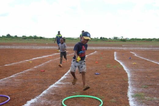 Little Atlegang Kolodi dropped a bean bag into a hula-hoop at speed.