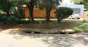 A damaged storm water drain in Coronation Street.