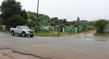 A motorist passes the area of Mpahla Village near where the attack at the first farm took place.