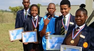The star learners, accompanied by the SAPS Social Crime Prevention and Domestic Violence Coordinator, Sergeant Thabo Mathebula. Photo: Supplied