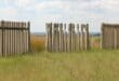 Some of the broken fencing at the side of the graveyard. Photo: Adele Louw (Carletonville and Fochville Herald)