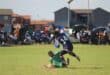 This player of Owasome (in green) did not let the ball fall into the hands of his City All Stars opponent. Photo: Adele Louw (Carletonville and Fochville Herald)