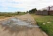 Sewage streaming down Danie Theron Street in Fochville has also caused damage to the road. Photo: Adele Louw (Carletonville and Fochville Herald)