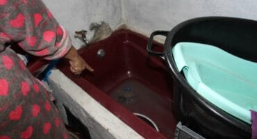 The affected residents such as Christina Modikoga have to reuse all the water they can. Photo: Adele Louw (Carletonville and Fochville Herald)