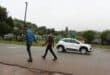 Residents of the Mpahla Village informal settlement walks in the road leading to the farm where the crime took place. Photo: Adele Louw (Carletonville and Fochville Herald)