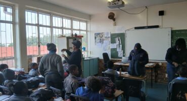Police members searching one of the classrooms. Photo: SAPS