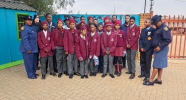 Fochville SAPS representatives with some of the learners of Reakgona Primary School. Photo: SAPS