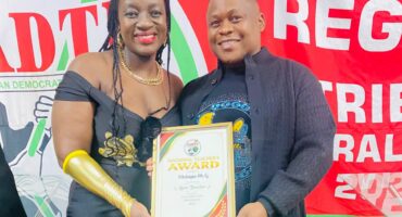 SADTU’s Fochville branch education convenor Tshepo Seeri (right), handing over an award to Ms M.G. Nhlapo. Photo: Supplied