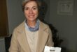 Linda Braukmann-Saayman with one of the beautifully wrapped mini fruit cakes. Photo: Adele Louw (Carletonville and Fochville Herald)