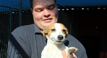 Carletonville SPCA staff member Adriaan van Niekerk with a beautiful Jack Russel needing a new home.