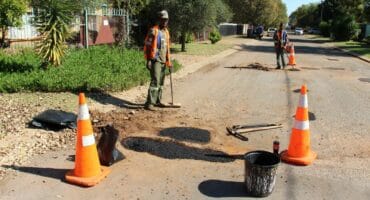 Members of the Our Town Fochville team fixing potholes in 8th Street in Fochville this week. Photo: Adele Louw (Carletonville and Fochville Herald)