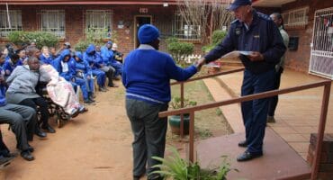 Captain Plastiek Janse van Vuuren hands over a certificate to one of the learners who participated. Photo: Adele Louw (Carletonville and Fochville Herald)