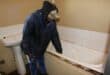 Kamogelo Xezile shows the loose bath in his family's bathroom. Photo: Adele Louw (Carletonville and Fochville Herald)