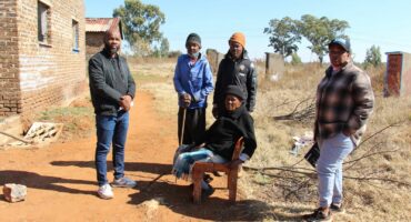 Dorah Molathlegi (in front) and Nelson Kalipha (second from left at the back) were visted by some community leaders this week. Photo: Adele Louw (Carletonville and Fochville Herald)
