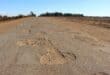 The road is riddled with massive potholes. Photo: Adele Louw (Carletonville and Fochville Herald)