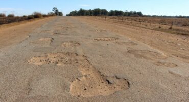 The road is riddled with massive potholes. Photo: Adele Louw (Carletonville and Fochville Herald)