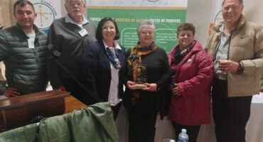 Facility Manager, Mrs Lynette Eybers (with trophy) with some supportive colleagues and community members. Photo: Supplied