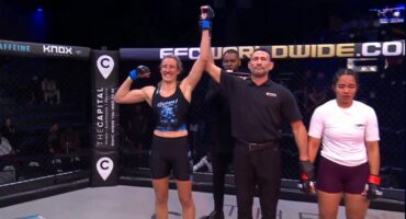 The referee lifts Charmaine Venter's hand triumphantly into the air after her win.