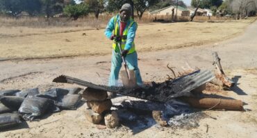 The residents use various ways to fix the many potholes in the town's streets. Photo: Supplied