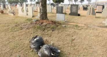 Bags of rubbish lying close to the graves. Photo: Adele Louw (Carletonville and Fochville Herald)