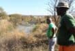 Concerned residents Lunga Zituta and Mike Mohoza looking at a dam of sewage behind Wedela Extension 1. Photo: Adele Louw (Carletonville and Fochville Herald)
