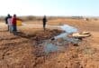 Community members gathered at the site of the sinking manhole on Monday morning. Photo: Adele Louw (Carletonville and Fochville Herald)