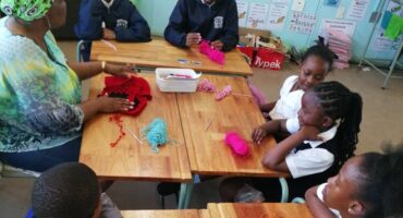 The learners are helped by a former teacher Mrs. Nana Moyema.