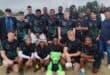 Die Scorpions se skitterende o19-rugbyspan saam met hul afrigter, Kobie Bosch.
