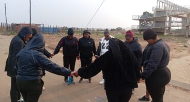The Greenspark women started with a prayer circle near the bridge.