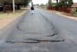 Some of the deep cracks in the newly tarred road in Station Street in Welverdiend.