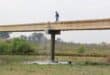 Sewage streaming from the broken pipe on the bridge. Photo: Adele Louw (Carletonville and Fochville Herald)
