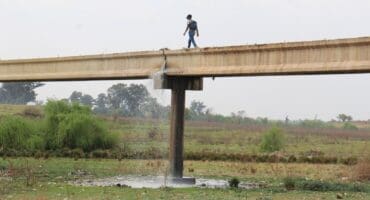 Sewage streaming from the broken pipe on the bridge. Photo: Adele Louw (Carletonville and Fochville Herald)