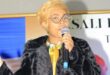 Dimpho the entrepreneur, events organiser and motivational speaker on stage.