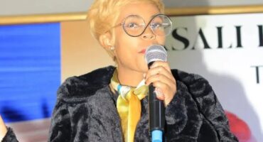 Dimpho the entrepreneur, events organiser and motivational speaker on stage.